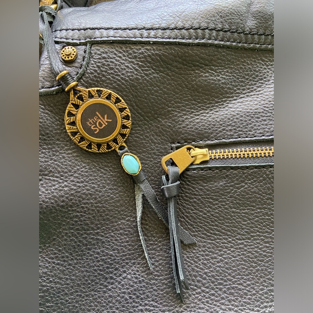 The Sak black leather and pink interior purse